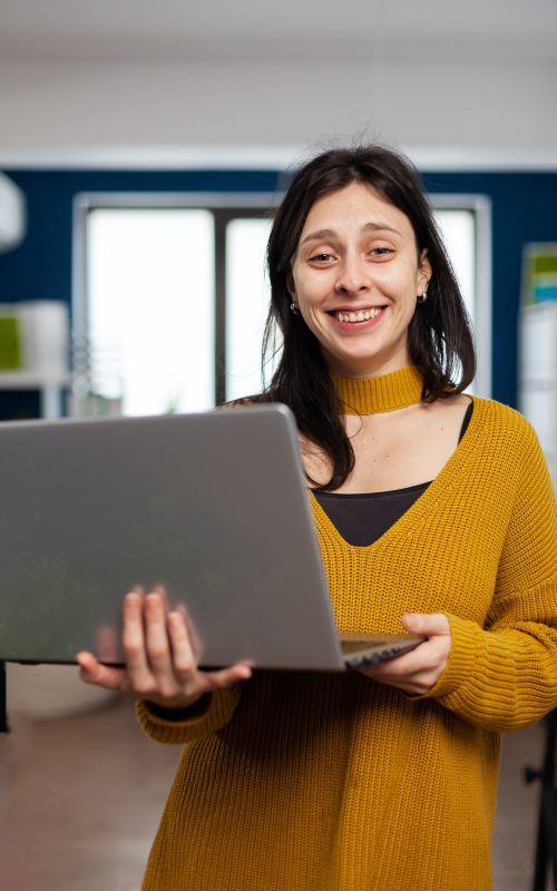 woman-retoucher-looking-at-camera-smiling-working-in-creative-media-agency.jpg